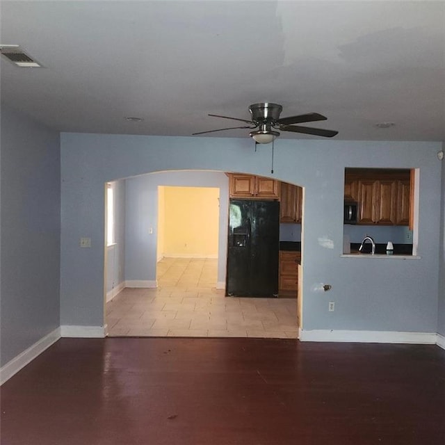 3020 Maureen Ln, Meraux, LA 70075 - unfurnished living room with arched walkways and ceiling fan