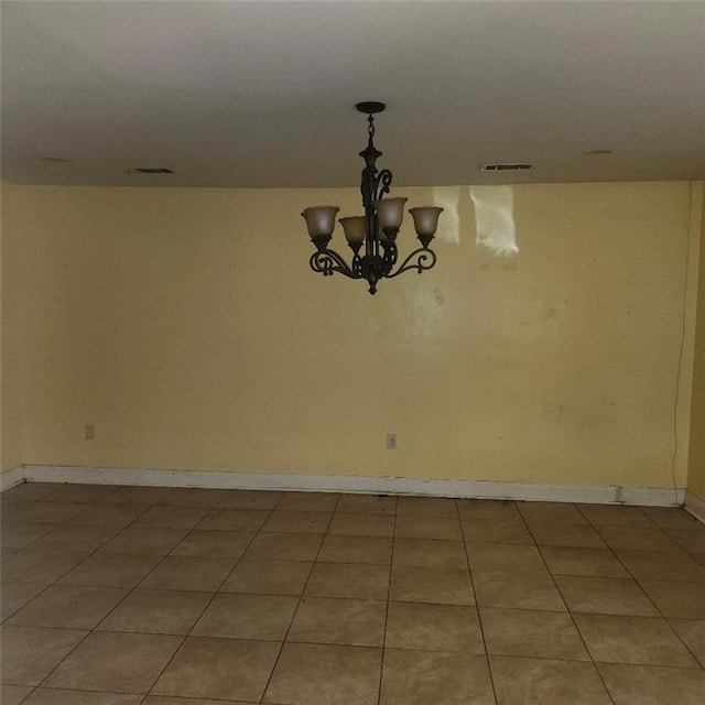 3020 Maureen Ln, Meraux, LA 70075 - spare room with a chandelier and light tile patterned flooring