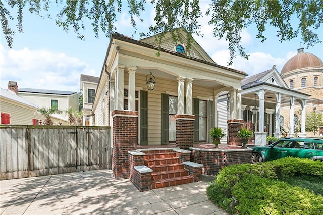 3354 Esplanade Ave, New Orleans, LA 70119 - view of front of home featuring brick siding and a porch