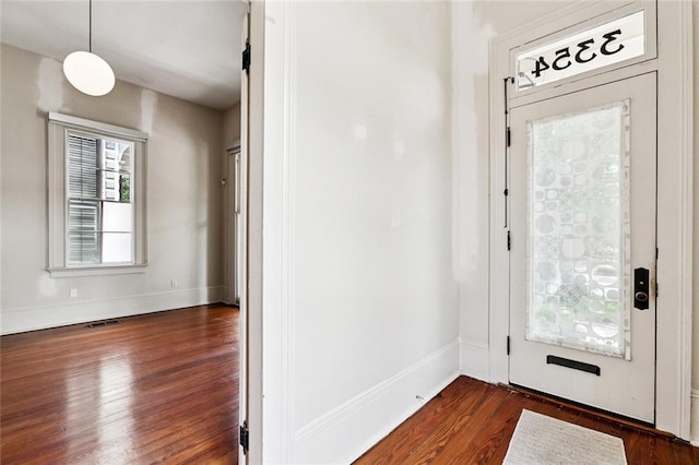 3354 Esplanade Ave, New Orleans, LA 70119 - foyer with dark wood-style flooring and baseboards