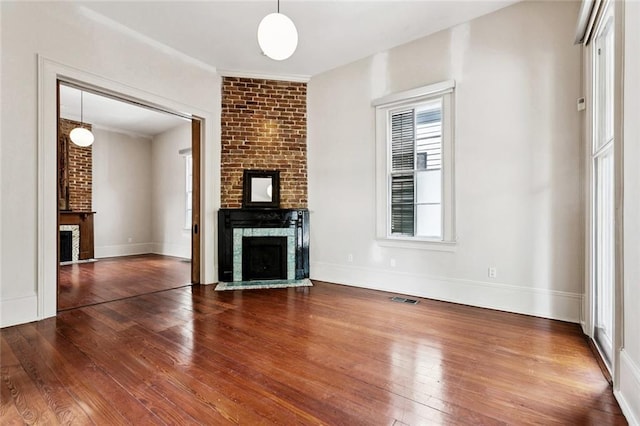 3354 Esplanade Ave, New Orleans, LA 70119 - unfurnished living room with a fireplace and wood-type flooring