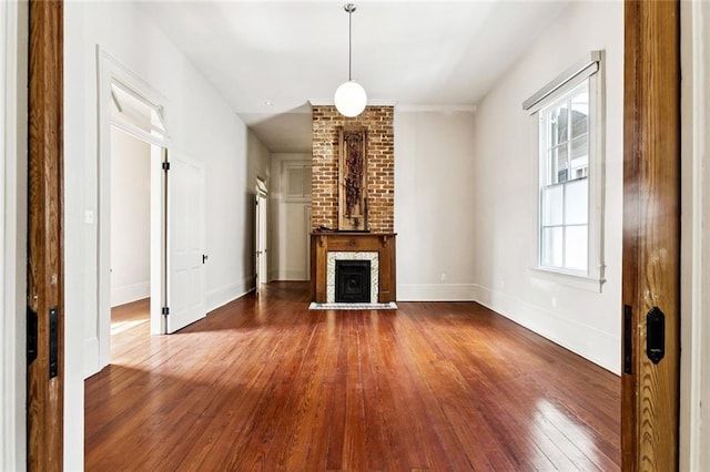 3354 Esplanade Ave, New Orleans, LA 70119 - unfurnished living room featuring dark wood-style floors and a fireplace