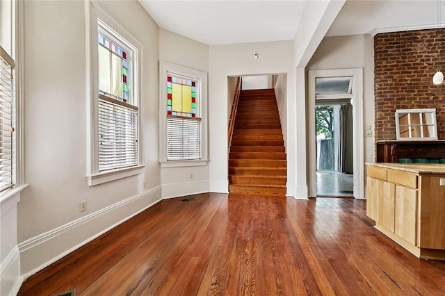 3354 Esplanade Ave, New Orleans, LA 70119 - interior space with dark wood finished floors and stairway