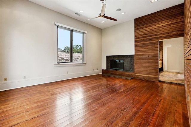 3354 Esplanade Ave, New Orleans, LA 70119 - unfurnished living room featuring hardwood / wood-style floors, a fireplace, a ceiling fan, and recessed lighting