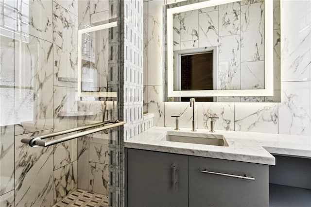 3354 Esplanade Ave, New Orleans, LA 70119 - full bathroom featuring vanity and a marble finish shower