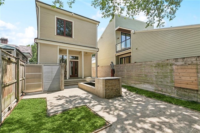3354 Esplanade Ave, New Orleans, LA 70119 - back of house featuring a patio area and a fenced backyard