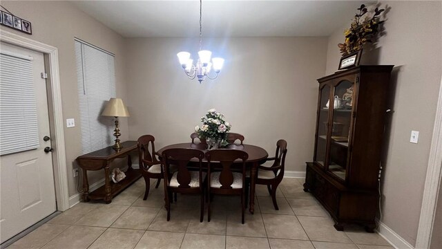40145 Taylors Trl Unit 304, Slidell, LA 70461 - dining room featuring a chandelier and light tile patterned flooring