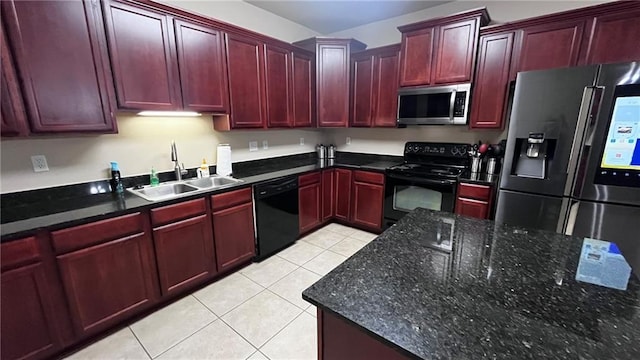 40145 Taylors Trl Unit 304, Slidell, LA 70461 - kitchen with black appliances, dark brown cabinets, light tile patterned floors, and dark stone countertops