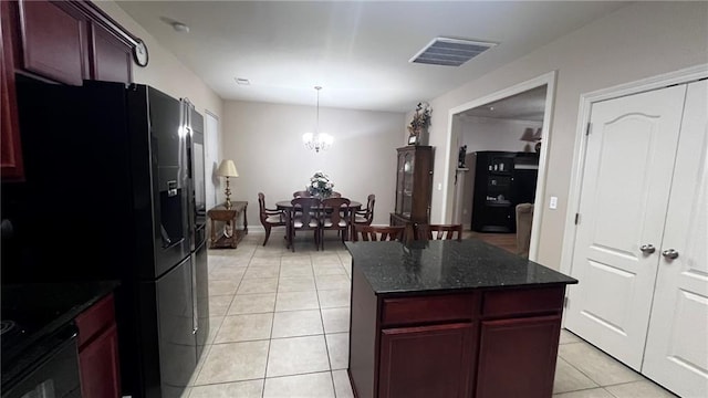 40145 Taylors Trl Unit 304, Slidell, LA 70461 - kitchen featuring black refrigerator with ice dispenser, light tile patterned flooring, dark brown cabinets, a chandelier, and a center island