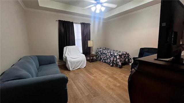40145 Taylors Trl Unit 304, Slidell, LA 70461 - bedroom with a tray ceiling, ornamental molding, light wood-style floors, and ceiling fan