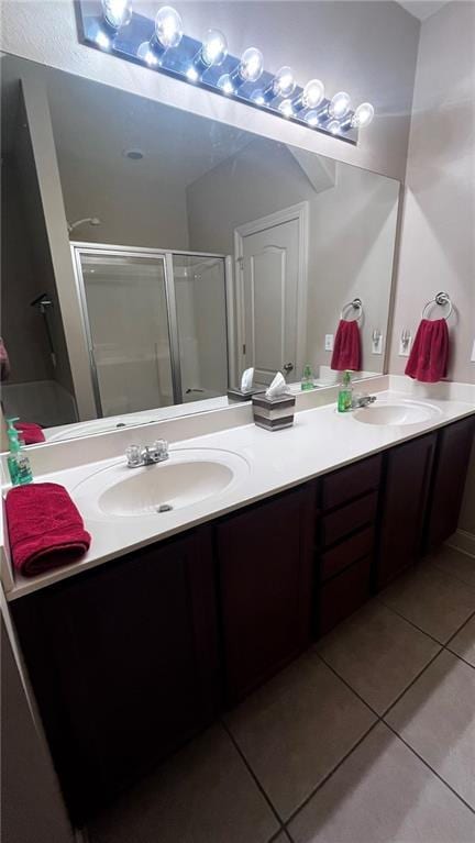 40145 Taylors Trl Unit 304, Slidell, LA 70461 - full bath with tile patterned flooring, double vanity, and a shower stall