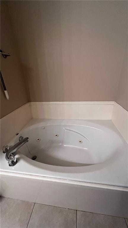 40145 Taylors Trl Unit 304, Slidell, LA 70461 - bathroom with tile patterned floors and a whirlpool tub