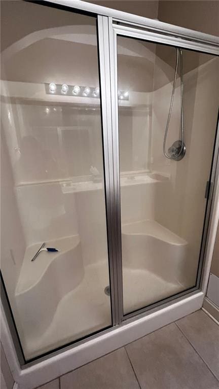 40145 Taylors Trl Unit 304, Slidell, LA 70461 - bathroom featuring tile patterned flooring and a stall shower