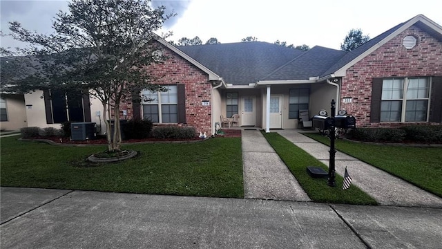 40145 Taylors Trl Unit 304, Slidell, LA 70461 - view of front of house featuring a front yard and brick siding