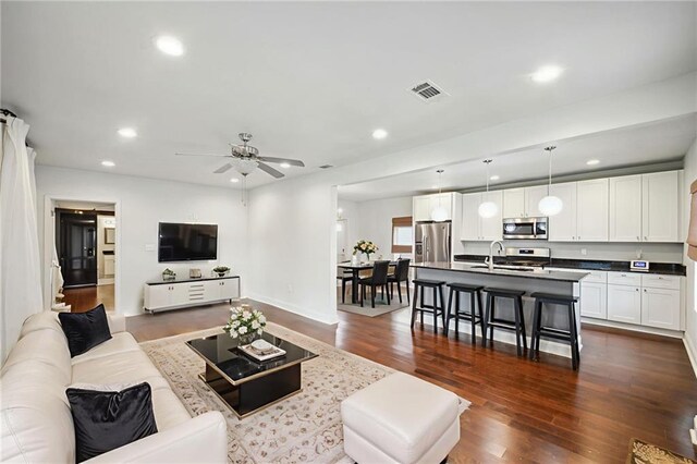 3606 N Miro St, New Orleans, LA 70117 - living area with recessed lighting, dark wood-style flooring, and ceiling fan