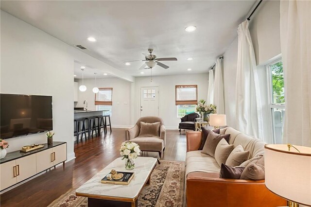 3606 N Miro St, New Orleans, LA 70117 - living room with dark wood finished floors, recessed lighting, and a ceiling fan