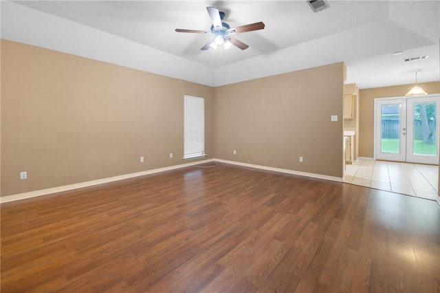 70405 F St, Covington, LA 70433 - empty room with a ceiling fan, wood finished floors, and french doors