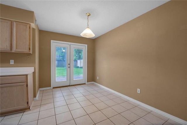 70405 F St, Covington, LA 70433 - doorway to outside with french doors and light tile patterned floors