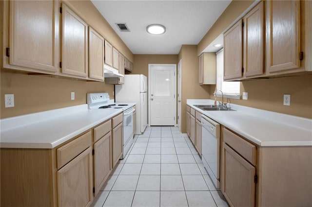 70405 F St, Covington, LA 70433 - kitchen featuring white appliances, light brown cabinetry, under cabinet range hood, light countertops, and light tile patterned flooring