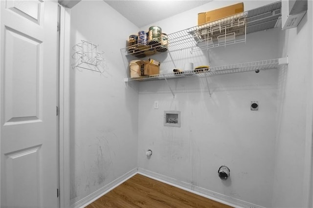 70405 F St, Covington, LA 70433 - laundry area featuring hookup for a washing machine, hookup for a gas dryer, electric dryer hookup, and wood finished floors