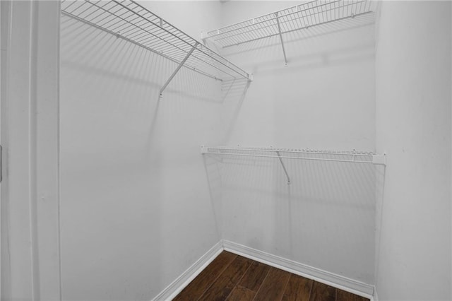 70405 F St, Covington, LA 70433 - spacious closet with dark wood-style floors
