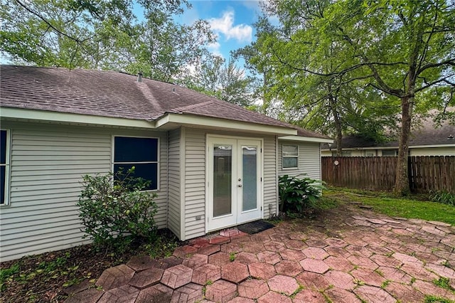 70405 F St, Covington, LA 70433 - back of house with french doors, a patio, and roof with shingles