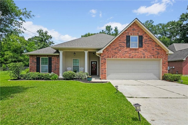 855 Woodsprings Ct, Covington, LA 70433 - view of front of house with driveway, a front yard, roof with shingles, stucco siding, and brick siding