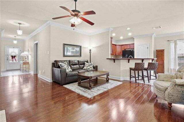 855 Woodsprings Ct, Covington, LA 70433 - living room featuring crown molding, ceiling fan, wood-type flooring, and recessed lighting