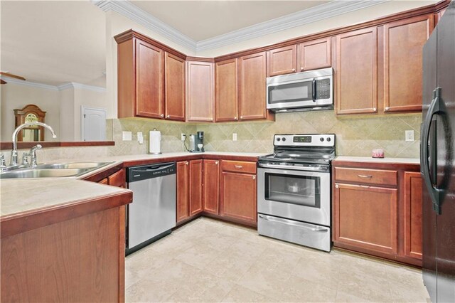 855 Woodsprings Ct, Covington, LA 70433 - kitchen with appliances with stainless steel finishes, ornamental molding, tasteful backsplash, a peninsula, and light countertops