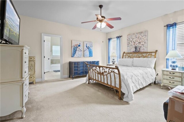 855 Woodsprings Ct, Covington, LA 70433 - bedroom with light carpet, connected bathroom, and ceiling fan