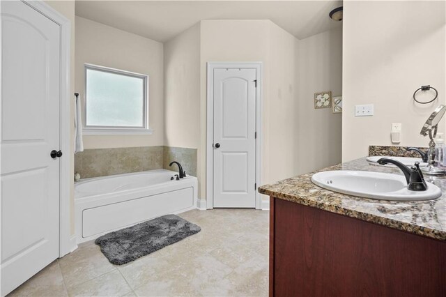 855 Woodsprings Ct, Covington, LA 70433 - bathroom with vanity, a bath, and tile patterned floors