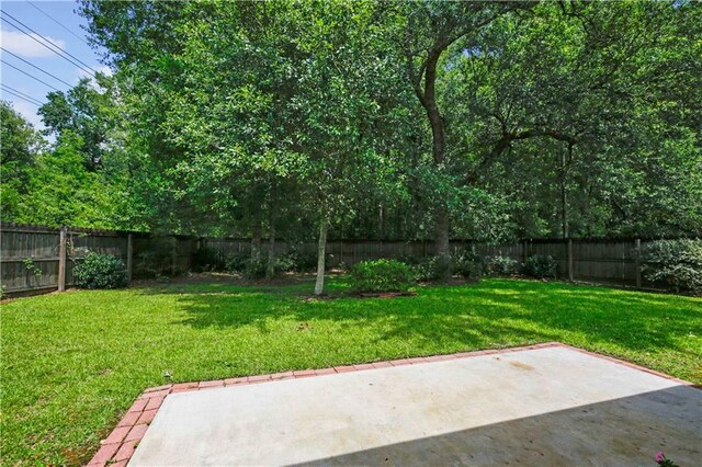 855 Woodsprings Ct, Covington, LA 70433 - fenced backyard featuring a patio area