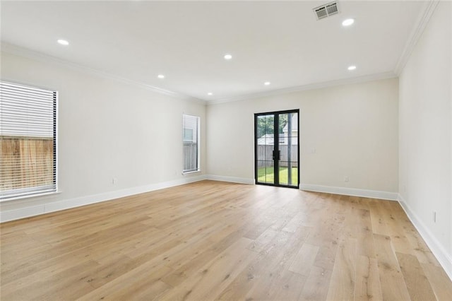 4542 Prairie St, Metairie, LA 70001 - spare room featuring crown molding, light wood-type flooring, and recessed lighting