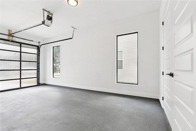 4542 Prairie St, Metairie, LA 70001 - garage featuring baseboards and a garage door opener
