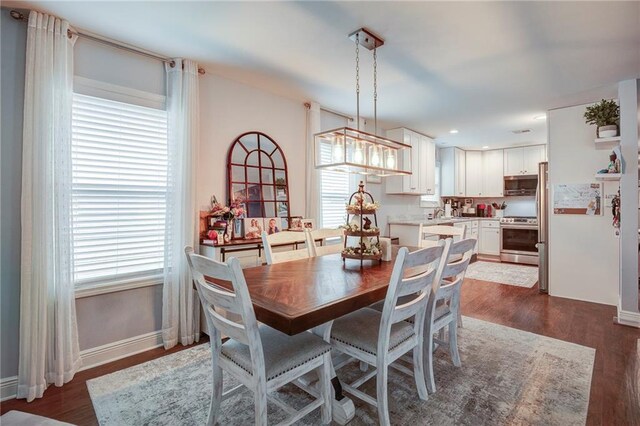 1112 Compromise St, Kenner, LA 70062 - dining space featuring dark wood-style floors and recessed lighting