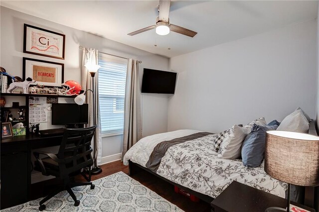 1112 Compromise St, Kenner, LA 70062 - bedroom featuring wood finished floors, an office area, and a ceiling fan