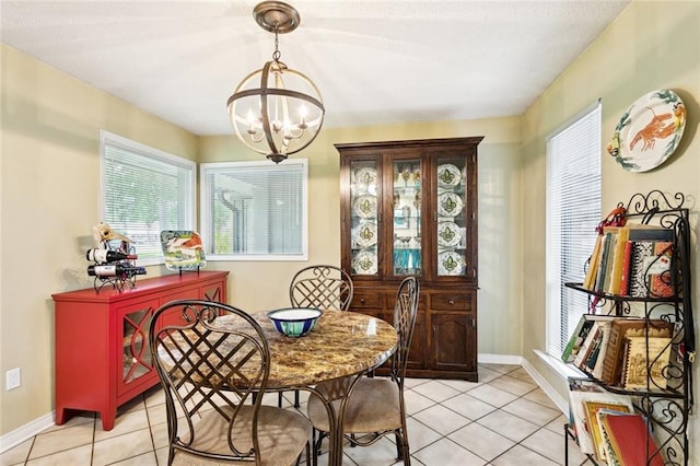 285 Oak Dr, Mandeville, LA 70471 - dining area featuring a chandelier and light tile patterned floors