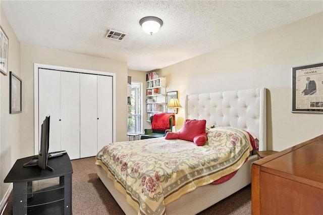 285 Oak Dr, Mandeville, LA 70471 - carpeted bedroom with a closet and a textured ceiling