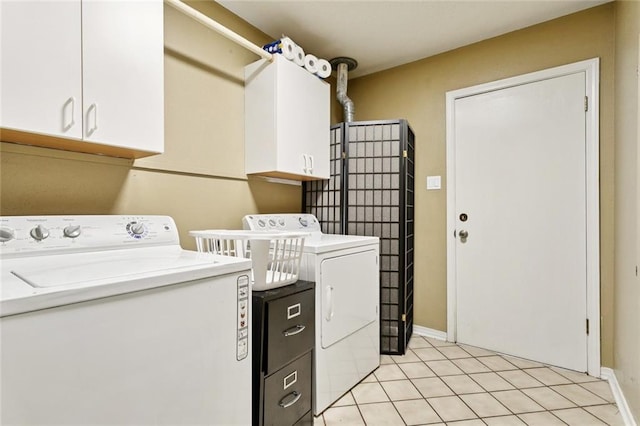 285 Oak Dr, Mandeville, LA 70471 - laundry area with independent washer and dryer, cabinet space, and light tile patterned floors