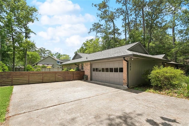 285 Oak Dr, Mandeville, LA 70471 - garage featuring concrete driveway