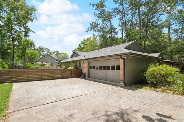 285 Oak Dr, Mandeville, LA 70471 - garage with concrete driveway