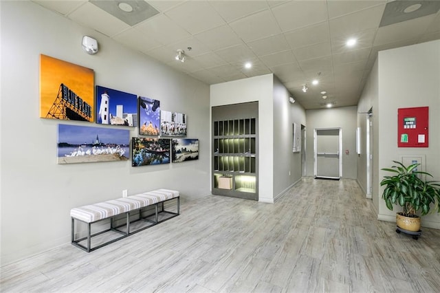 835 Julia St Unit 8, New Orleans, LA 70113 - corridor with wood finished floors, a paneled ceiling, and recessed lighting