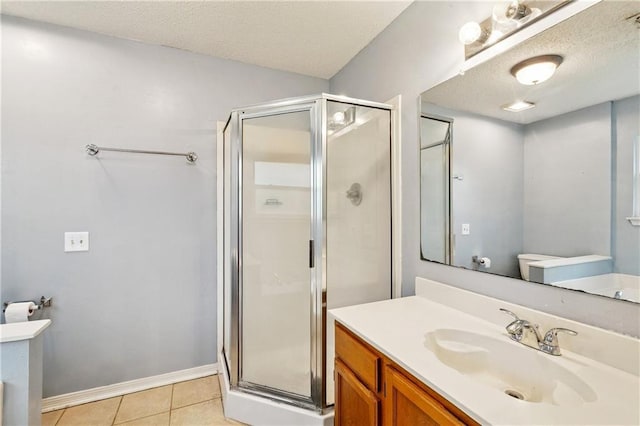 310 Oakley Ln, Destrehan, LA 70047 - bathroom featuring vanity, a stall shower, tile patterned flooring, and a textured ceiling