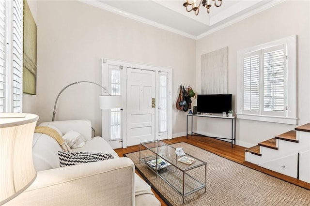 917 Joliet St, New Orleans, LA 70118 - living room with wood finished floors, ornamental molding, a chandelier, and stairs