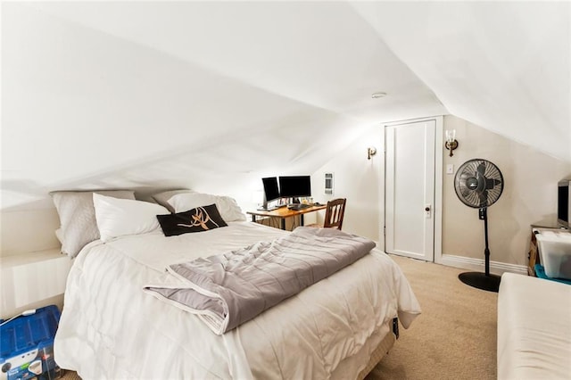 917 Joliet St, New Orleans, LA 70118 - carpeted bedroom with vaulted ceiling and baseboards