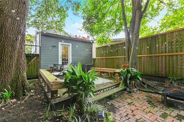 917 Joliet St, New Orleans, LA 70118 - rear view of house featuring a deck, a patio area, and a fire pit