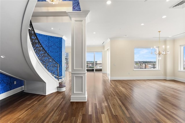 625 St Charles Ave Phd, Phd, New Orleans, LA 70130 - entrance foyer featuring decorative columns, ornamental molding, a chandelier, wood finished floors, and stairway