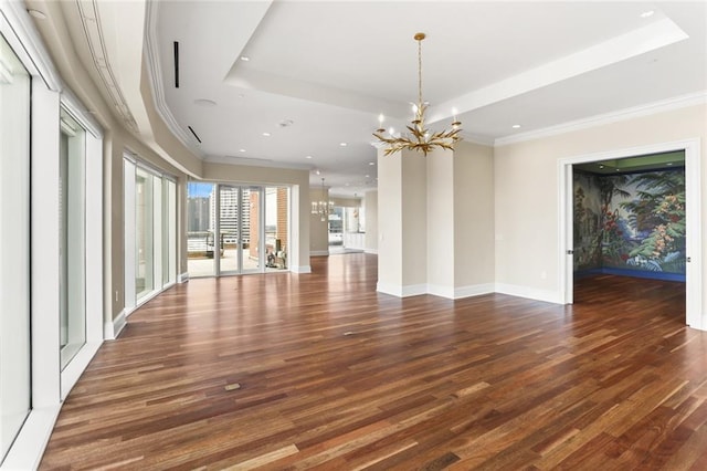 625 St Charles Ave Phd, Phd, New Orleans, LA 70130 - unfurnished living room with a chandelier, a tray ceiling, wood finished floors, recessed lighting, and crown molding