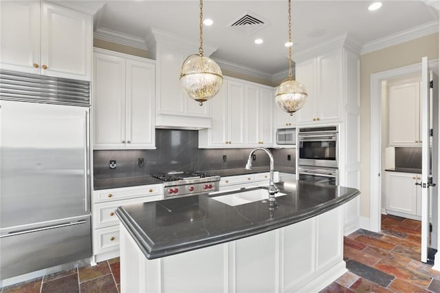 625 St Charles Ave Phd, Phd, New Orleans, LA 70130 - kitchen with appliances with stainless steel finishes, stone tile floors, recessed lighting, white cabinets, and backsplash