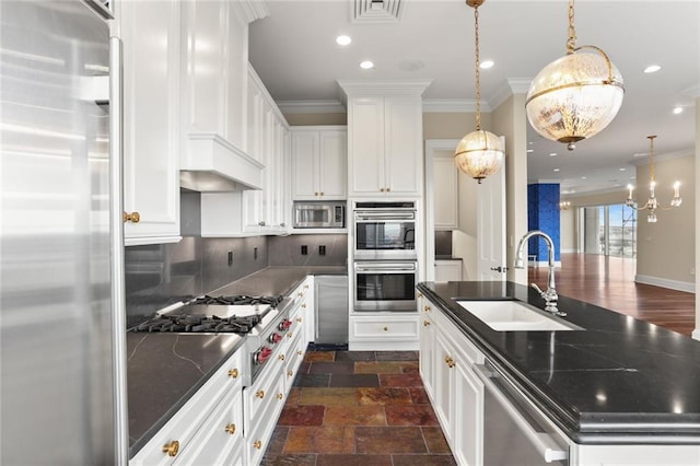 625 St Charles Ave Phd, Phd, New Orleans, LA 70130 - kitchen featuring stainless steel appliances, decorative backsplash, a kitchen island with sink, white cabinets, and ornamental molding